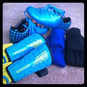Children’s soccer cleats, shin guards and socks.